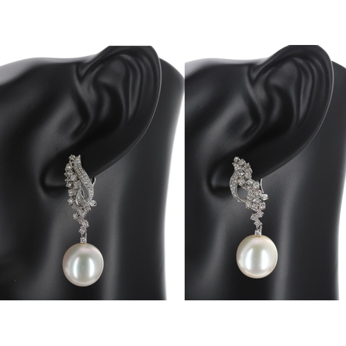 141 - Attractive pair of 18k white gold diamond and south sea pearl drop earrings, round brilliant-cuts, t... 