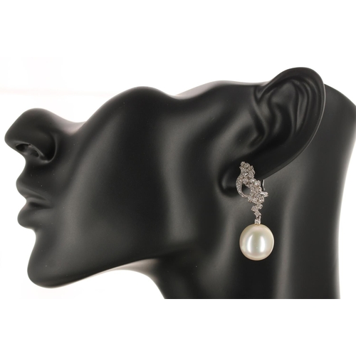 141 - Attractive pair of 18k white gold diamond and south sea pearl drop earrings, round brilliant-cuts, t... 