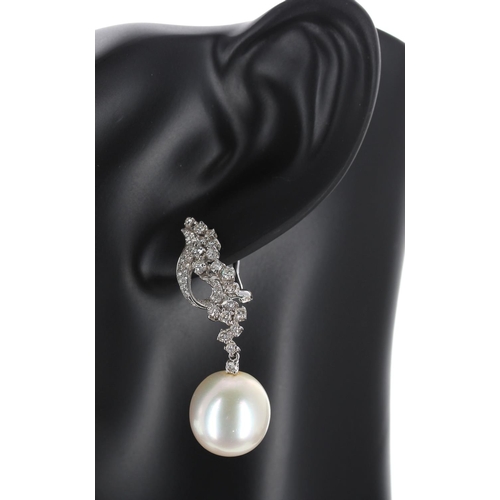 141 - Attractive pair of 18k white gold diamond and south sea pearl drop earrings, round brilliant-cuts, t... 