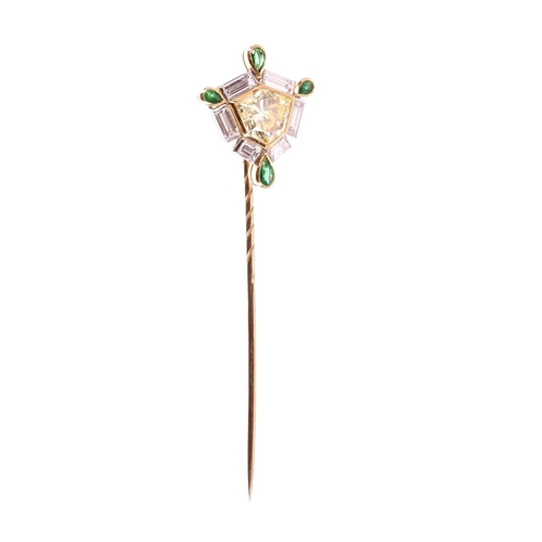 150 - Exquisite modified kite-shapped yellow diamond, baguette-cut diamond and emerald set pin, the yellow... 