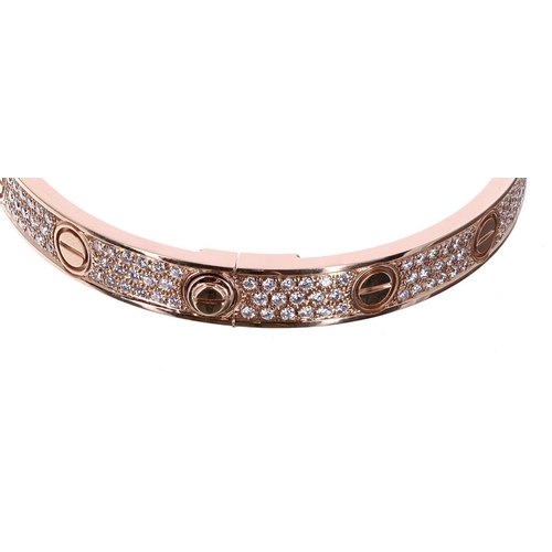 158 - Cartier 18ct rose gold diamond paved 'Love' bangle, size 19, set with 204 round brilliant-cut dimaon... 