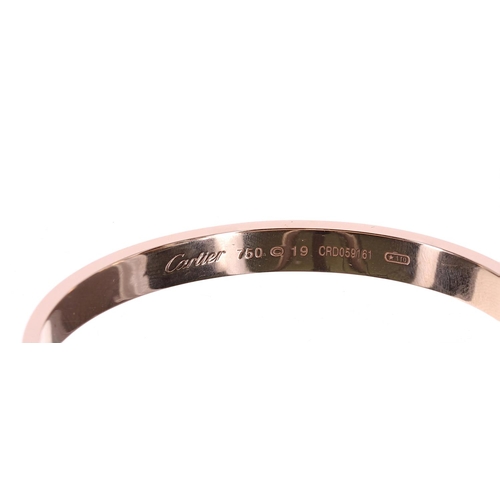 158 - Cartier 18ct rose gold diamond paved 'Love' bangle, size 19, set with 204 round brilliant-cut dimaon... 