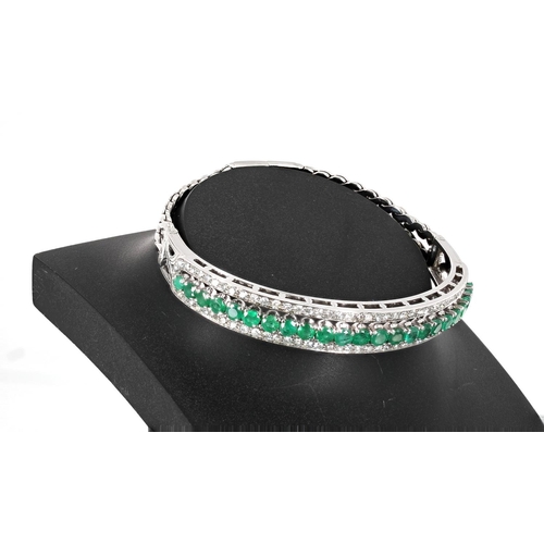 171 - Attractive emerald and diamond white gold bracelet, with a centre band consisting of twenty-three ro... 