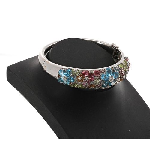 172 - 14k white gold multi-coloured gem set hinged bangle, signed Celamoro, width 16mm 36gm (40)