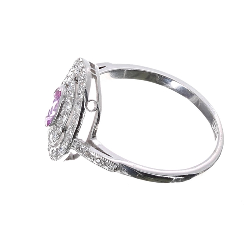 183 - Pretty 18ct white gold pink sapphire and diamond halo set oval cluster ring, the sapphire .36ct, in ... 