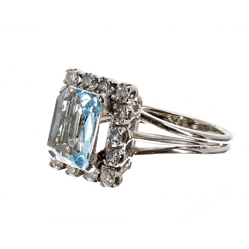 185 - Attractive white gold aquamarine and diamond rectangular dress ring, the aquamarine 1.79ct, with a s... 