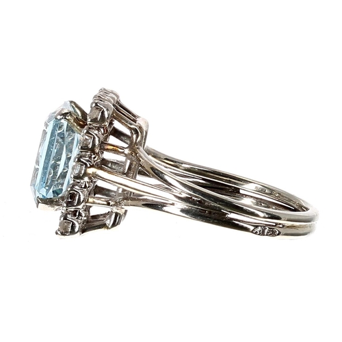 185 - Attractive white gold aquamarine and diamond rectangular dress ring, the aquamarine 1.79ct, with a s... 