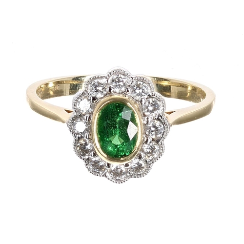 186 - 18ct green garnet and diamond oval cluster ring, the garnet 0.82ct approx in a setting of round bril... 