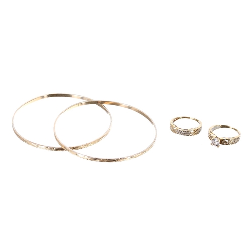 71 - Two yellow gold bangles, stamped 14ct, 12.4gm; two stone set rings marked 18k, 5.7gm (4) (224) **BAN... 