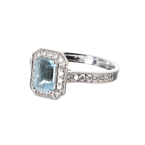 81 - 18ct white gold aquamarine and diamond halo set ring, the aquamarine 0.74ct approx, cluster 11mm x 9... 