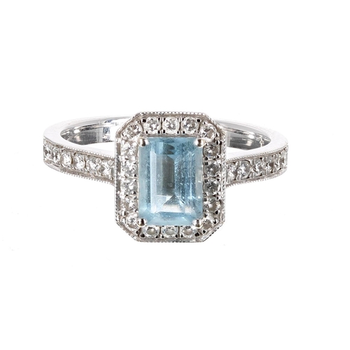 81 - 18ct white gold aquamarine and diamond halo set ring, the aquamarine 0.74ct approx, cluster 11mm x 9... 