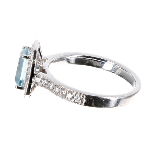 81 - 18ct white gold aquamarine and diamond halo set ring, the aquamarine 0.74ct approx, cluster 11mm x 9... 