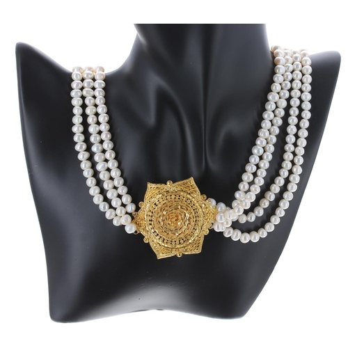 93 - Freshwater multi-strand pearl necklace with yellow metal flower pendant and clasp, 150.2gm, the pend... 