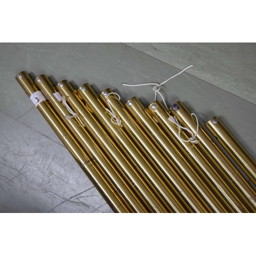 1309 - Set of nine large brass tubular bells within a soft bag