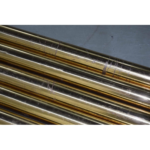 1309 - Set of nine large brass tubular bells within a soft bag