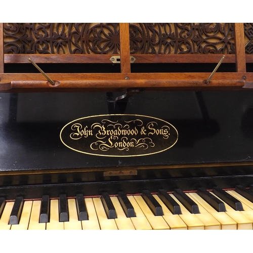 1231 - Upright piano by John Broadwood & Sons, London, 1873, the case of burr walnut with intricately frett... 