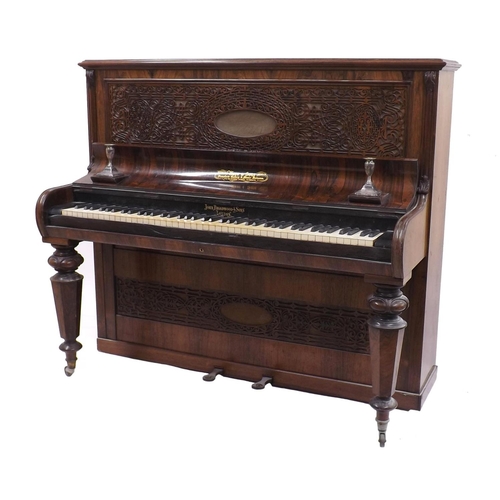 1232 - Upright piano by John Broadwood & Sons, London, 1879, the case of rosewood with two intricately fret... 