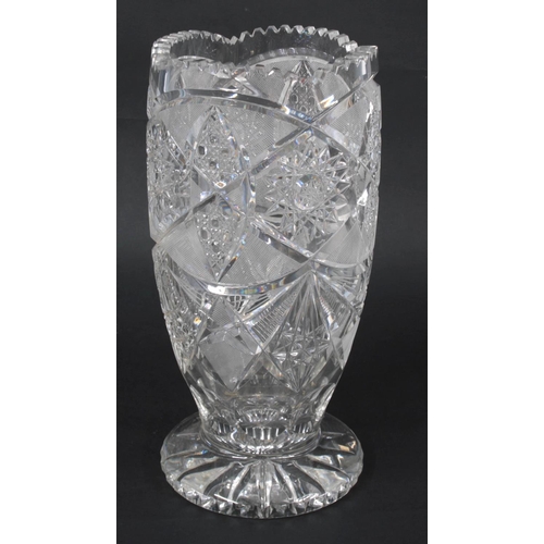 325 - Good quality heavy cut glass vase, with star burst and geometric decoration around, on a circular fo... 