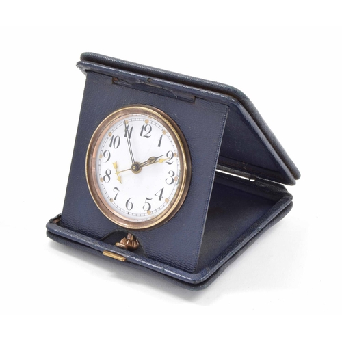 2503 - Swiss travelling alarm clock within a blue folding case, 4.25