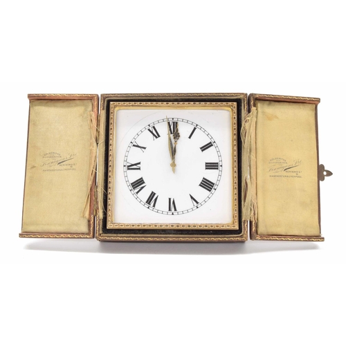 2504 - Goldsmiths & Silversmiths eight days gild metal strut clock, the white dial with Roman numerals, eas... 