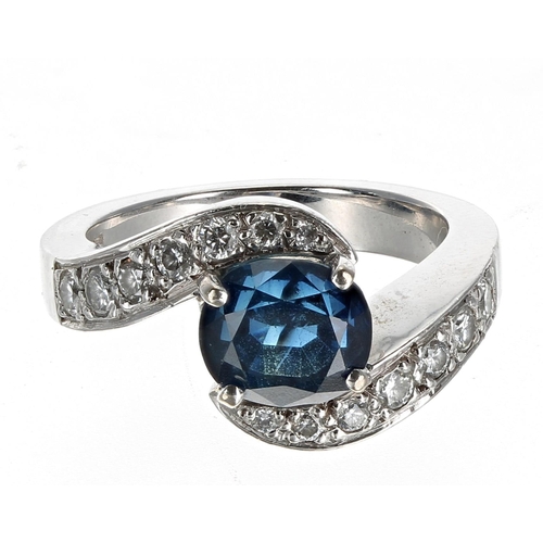 139 - 18k white gold sapphire and diamond cross-over design ring, the sapphire 1.70ct approx, diamonds 0.5... 