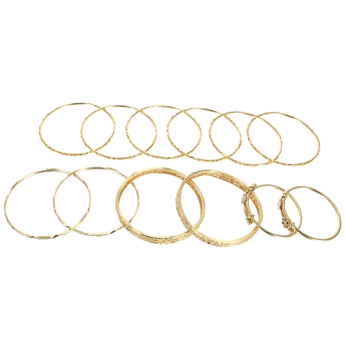 81 - Twelve assorted yellow gold bangles, 194.4gm (140186-1-A)