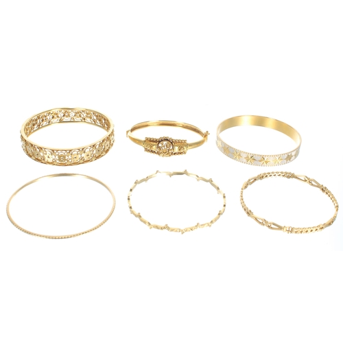 82 - Eleven assorted high grade yellow metal bangles, 244gm (140186-2-A)