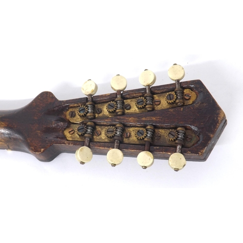 1215 - Interesting and unusual unlabelled pear shaped flatback mandolin, with classical inlay to the chevro... 