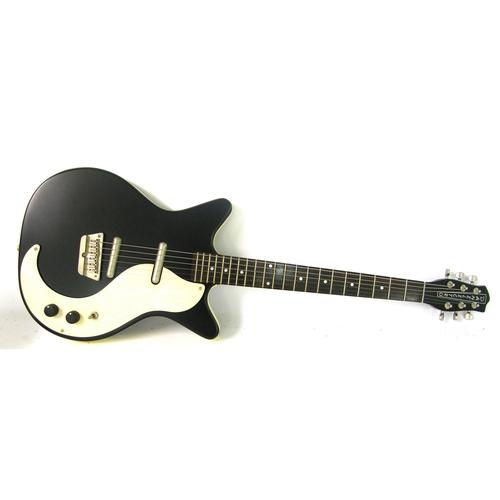 83 - Danelectro '59 double cutaway electric guitar, black finish, electrics appear to be in working order... 