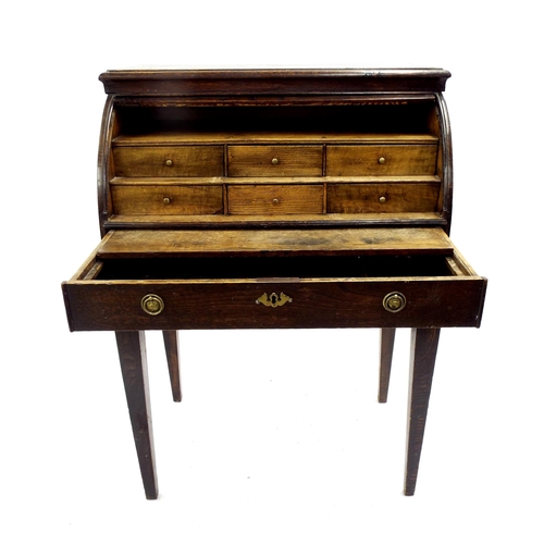 200 - 19th century oak cylinder desk, opening to reveal a two tier stepped interior of six small drawers o... 