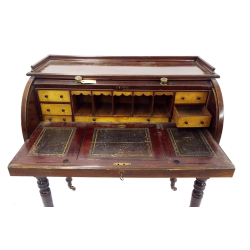 208 - Late 19th century mahogany roll top desk, the tambour front enclosing a fitted interior over a pull-... 