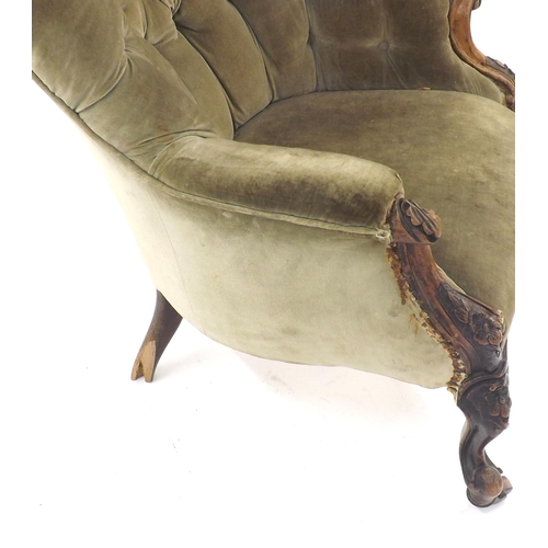 230 - Victorian button back upholstered chair upon castors (a.f.)