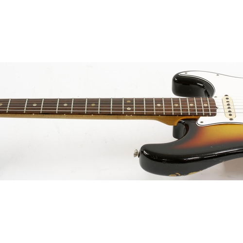 348 - 1965 Fender Stratocaster electric guitar, made in USA, ser. no. L5xxx6; Finish: sunburst, buckle ras... 