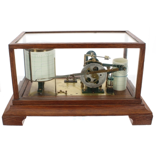 1084 - Oak cased Electrical Recording Rain Gauge signed Negretti & Zambra, no. 240 on the brass bed pla... 