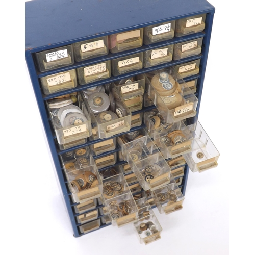 663 - Sixty drawer storage unit containing a quantity of various sized watch glasses