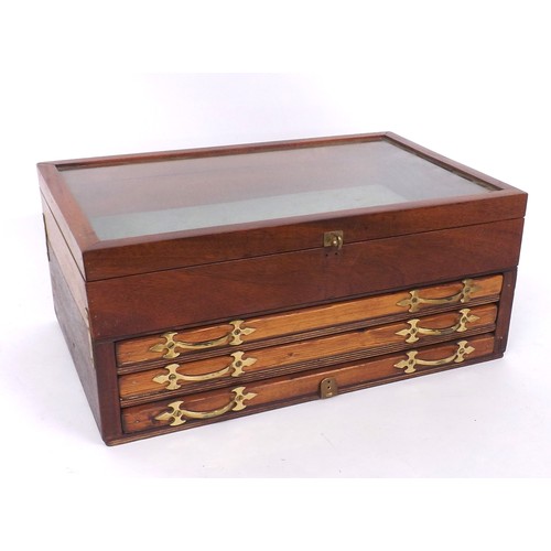 809 - Wooden glass top display cabinet, with three long drawers with brass handles and hinged glass top, 1... 