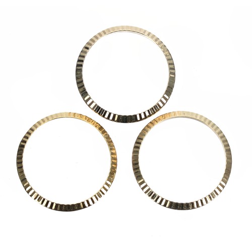 601 - Rolex - three 18ct lady's fluted bezels, 25mm (3)