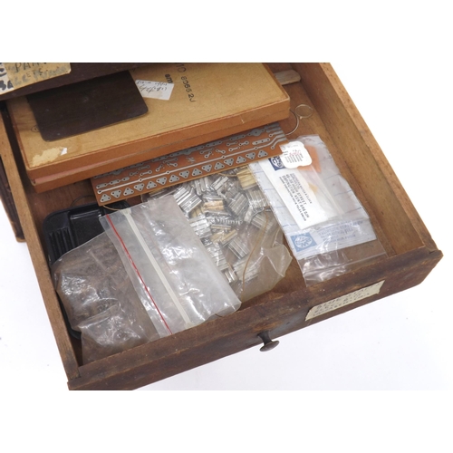 825 - Wooden six drawer watchmaker's chest with assorted contents, 11.25