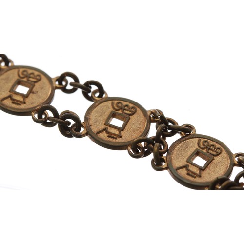 357 - Unusual Japanese coin gilt metal watch Albert chain, with T-bar and end clasp, 29.7gm, 14