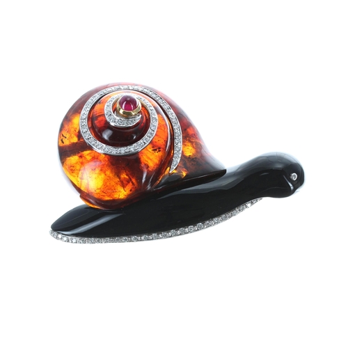 486 - Unusual 18ct mounted amber and diamond snail design brooch, set with a cabouchon ruby, 31.1gm, 57mm ... 