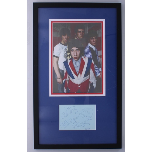 573 - The Who - autographed blue page, framed and mounted below a colour photograph, 24