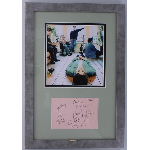 577 - Oasis - autographed page, framed and mounted beneath a colour picture, 20