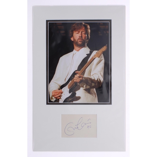 581 - Eric Clapton - autograph page, inscribed 'Eric Clapton, 92', mounted with colour picture, 19