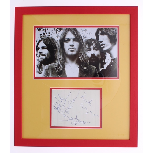 582 - Pink Floyd - autographed page, mounted and framed beneath a black and white picture, 20