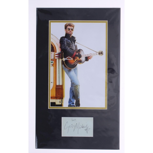 583 - George Michael - autograph page inscribed 'Love George Michael', mounted beneath a coloured picture,... 