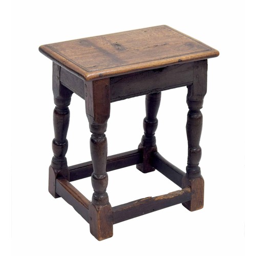 345 - Antique oak joynt stool, the moulded top over turned supports united by stretchers, 18.25