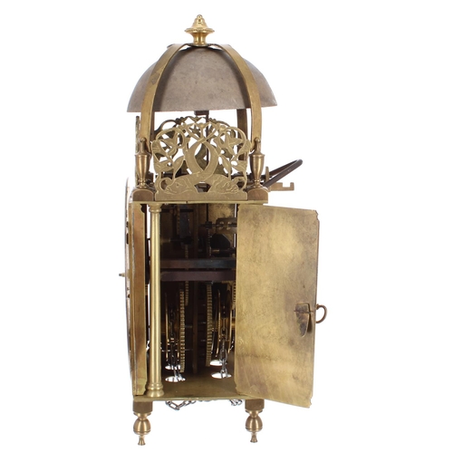 1344 - Continental brass lantern clock, the 6.75” silvered dial enclosing a foliate engraved centre, surmou... 