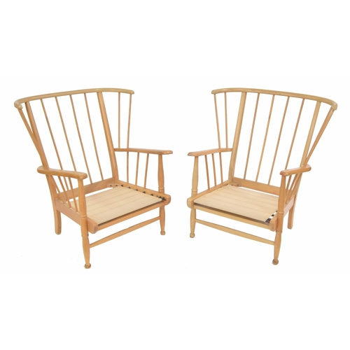 340 - Pair of Ercol style stick back beech lounge chairs, largest 30.5