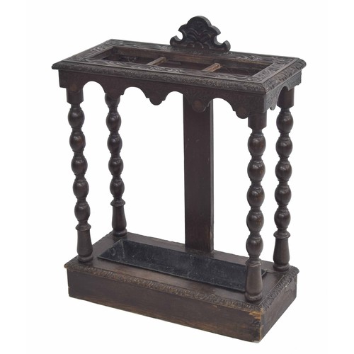 359 - Carved oak umbrella/stick stand, raised on turned supports, 23.5