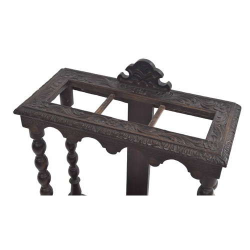 359 - Carved oak umbrella/stick stand, raised on turned supports, 23.5